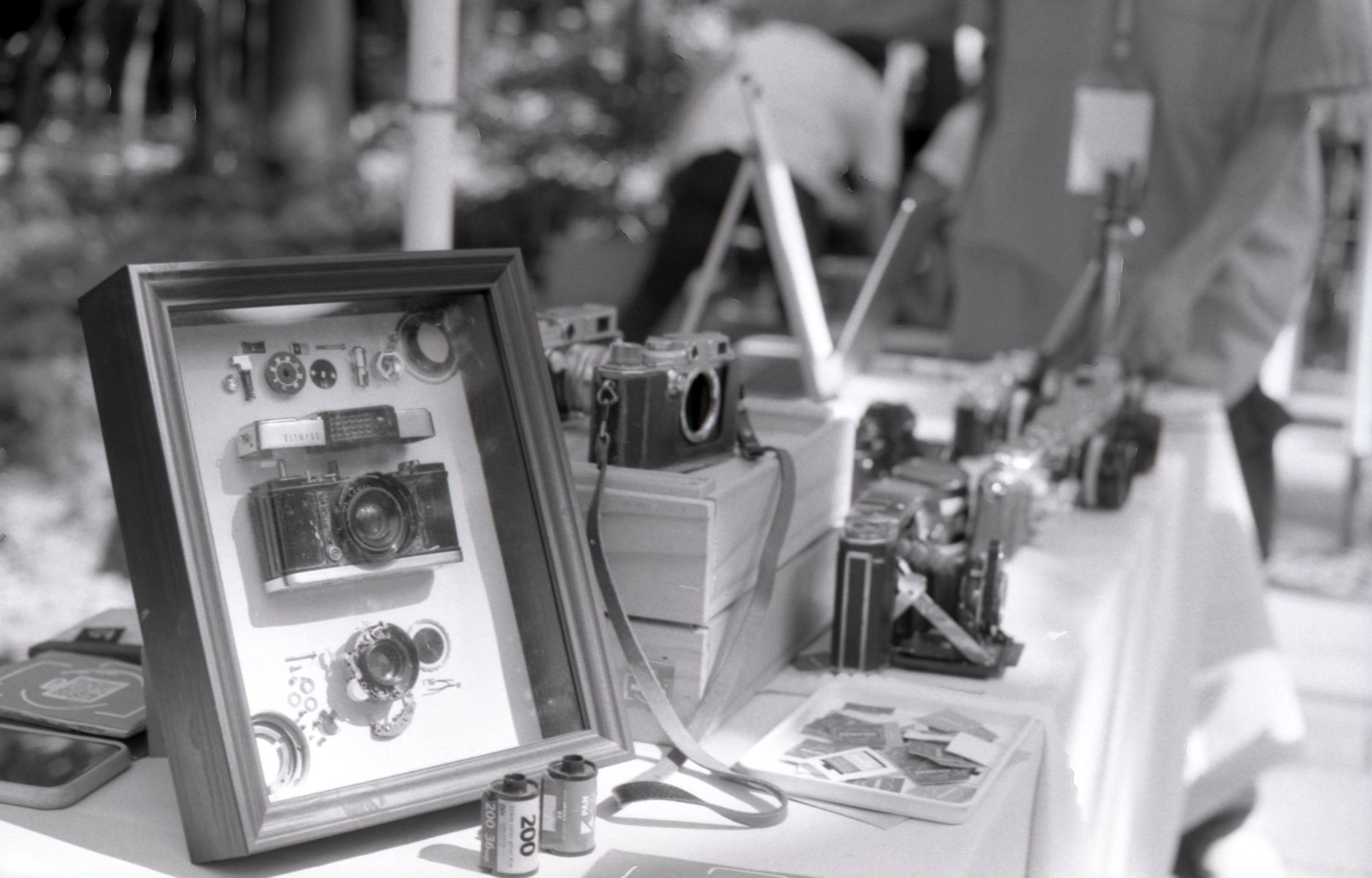 Display of various vintage cameras and analogue film at an outdoor exhibit in Taipei, Taiwan.